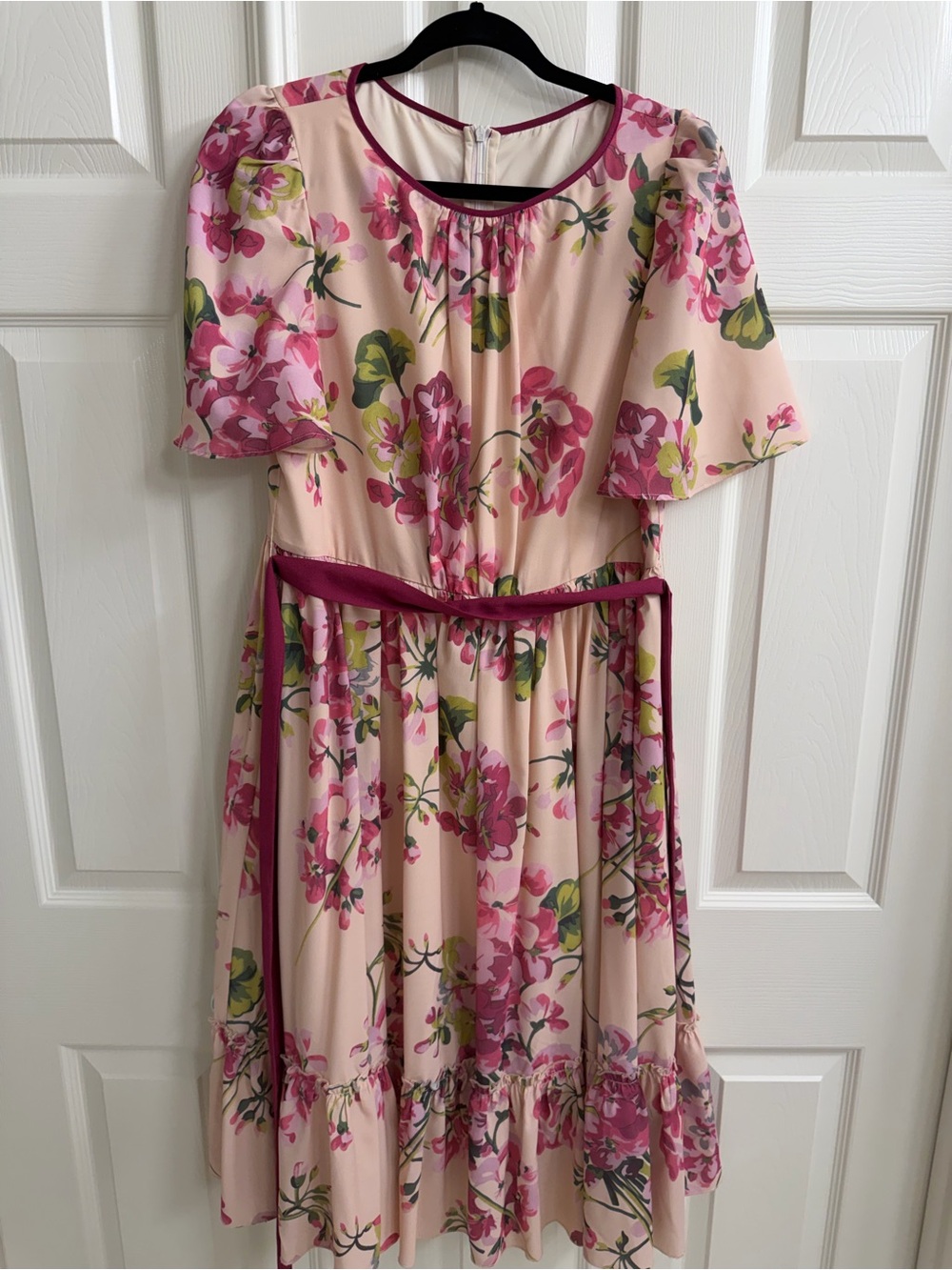 Midi floral dress. Light and flowy. Has a sash to tie around the waist.